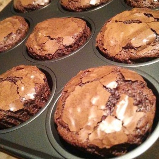 Healthy Brownie Muffins Looking for a guilt-free treat that satisfies your chocolate cravings? These lightened-up brownie muffins are the perfect solution! Packed with rich cocoa flavor but without the heavy ingredients, they're a delicious and surprisingly simple dessert. This recipe uses simple swaps like egg whites for lift and a sweetener in place of sugar, making them a much lighter option. Whether you're watching your intake or just want a healthier indulgence, these brownie muffins are sure to become a new favorite. Get ready to enjoy a fudgy, chocolatey treat without the guilt! About Time: Prep time: 15-20 minutes. Bake time: 20-25 minutes. Total time: 35-45 minutes. Yield: 12-16 brownie muffins Ingredients : 6 eggs (separated) 70g sweetener (erythritol, stevia, or your preferred type) 60g cocoa powder (unsweetened, not hot chocolate mix) 1 tsp vanilla extract Frylight or cooking spray Instructions: Preheat and Prepare: Preheat your oven to 180°C (350°F). Lightly spray a muffin tin with Frylight or cooking spray. You can also use muffin liners for easier removal, but spray them as well to prevent sticking. Whisk Egg Whites: In a clean bowl, whisk the egg whites until they form soft peaks. Don't over-whip, or they'll become dry. Combine Egg Yolks and Dry Ingredients: In a separate bowl, whisk together the egg yolks, sweetener, vanilla extract, and cocoa powder. If the mixture is too thick, add a tablespoon or two of water to loosen it up. Fold in Egg Whites: Gently fold the egg whites into the yolk mixture in two or three additions. Be careful not to overmix, as this will deflate the egg whites and result in denser brownies. Use a spatula or spoon and fold gently, lifting from the bottom and over the top. Fill Muffin Cups: Spoon the batter into the prepared muffin cups, filling each about ¾ full. This will allow for some rise. Bake: Bake for 20-25 minutes. Since muffin cups are smaller than a cake tin, they'll likely bake faster. Check for doneness by inserting a toothpick into the center of a brownie. It should come out with just a few moist crumbs attached, not wet batter. Cool and Serve: Let the brownies cool in the muffin tin for a few minutes before transferring them to a wire rack to cool completely. If you used liners, they should be easy to remove once cooled. Tips for Muffin Brownies: Don't Overfill: Filling the muffin cups too high will cause the brownies to overflow and create a mess. Check Doneness Early: Start checking for doneness at 20 minutes. Smaller muffins bake faster than a large brownie. Cooling is Key: Let the brownies cool sufficiently before attempting to remove them from the tin, especially if you didn't use liners. This will prevent them from crumbling. Variations: You can add sugar-free chocolate chips, chopped nuts, or a swirl of peanut butter to the batter before baking for added flavor. Enjoy your delicious and portion-controlled brownie muffins!